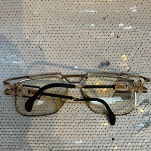 Vintage gold/black Cazal glasses. Needs cleaning, right arm broke. Priced to go